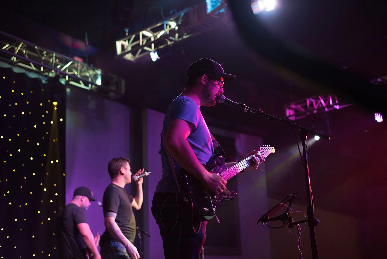 The band under colorful stage lights